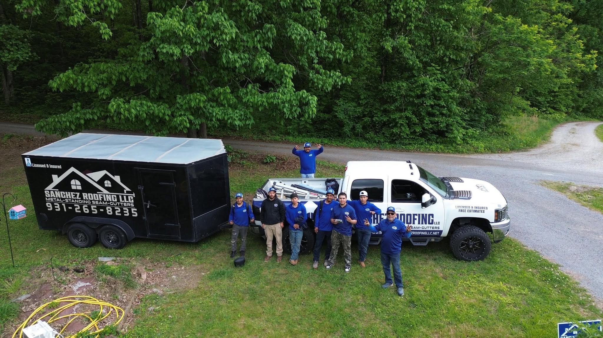 The Sanchez Roofing crew standing together.