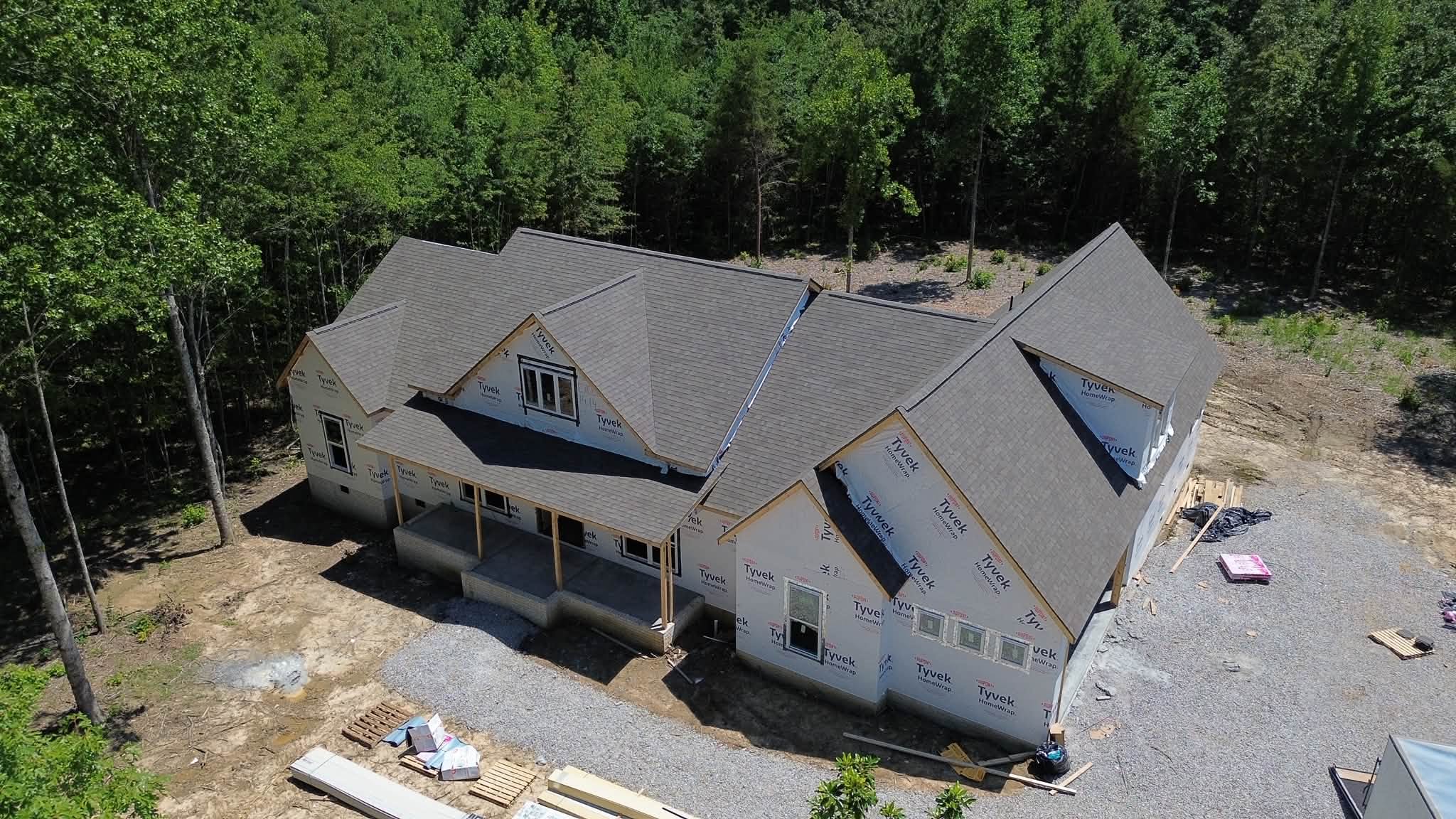 A house in construction with a grey roof