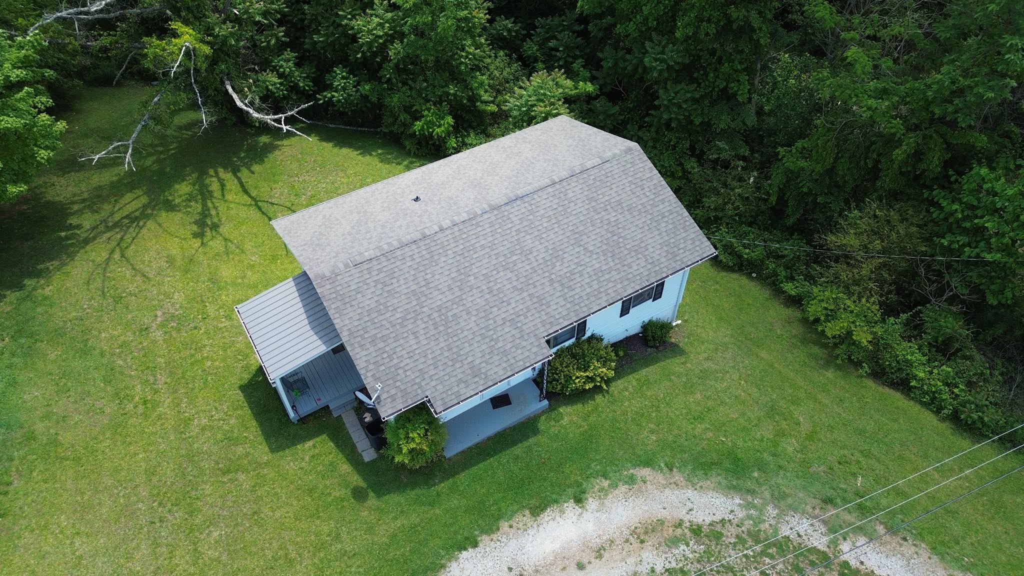 A brick house with a new roof.