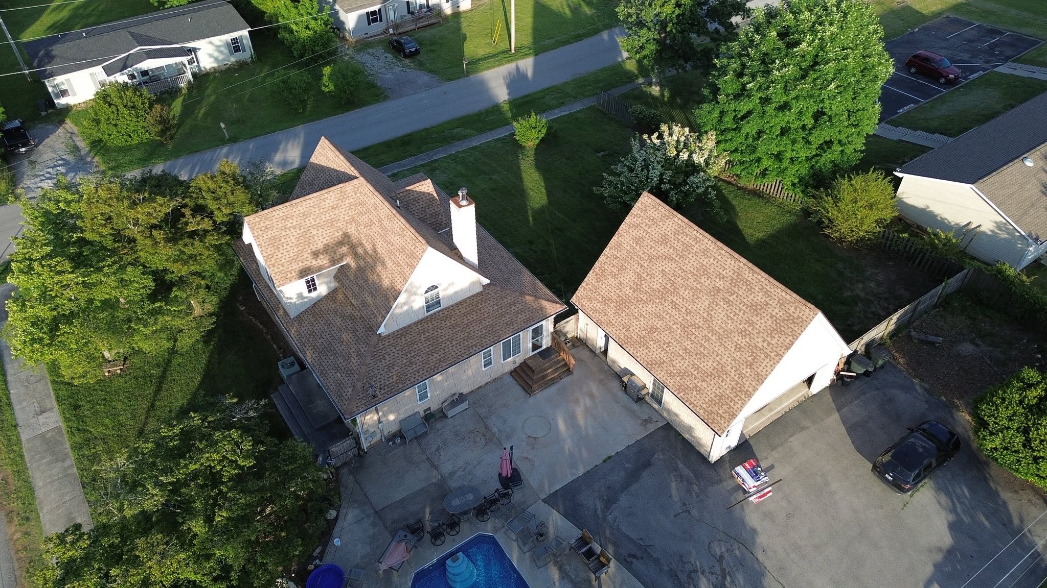 A brick house with a new roof.